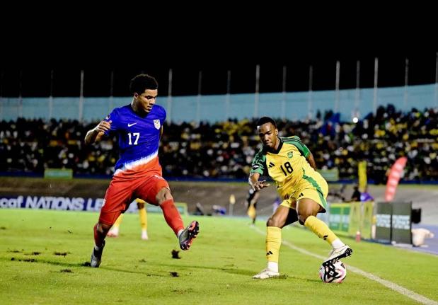 Jamaica’s Tyreek Magee (right) tries to evade the challenge of the United States’ Malik Tillman during a Concacaf Nations League, League A quarter-final match at the National Stadium on November 14, 2024.
