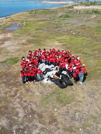 Scotia Foundation volunteers pose proudly after removing 138 bags of waste and recyclables from the coastline during their activities for International Coastal Cleanup Day.
