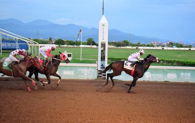 UNSPUN (right), ridden by Reyan Lewis, wins the Typewriter Trophy feature event ahead of INTRESTNTIMESAHEAD (Shane Ellis) at Caymanas Park on September 28.