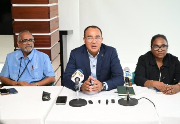 Health and Wellness Minister, Dr Christopher Tufton (centre), addressing a press briefing at S Hotel in Montego Bay, St James on October 9. He is joined by Clinical Coordinator at the Western Regional Authority, Dr Delroy Fray (left) and Regional Technical