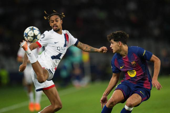 PSG’s Bradley Barcola (left) controls the ball ahead of Barcelona’s Pau Cubarsi during the Champions League opening phase match at the Lluis Companys Olympic Stadium in Barcelona, Spain, on Wednesday, October 1. 