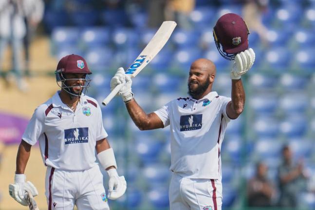 West Indies’ John Campbell (right) celebrates after scoring a century as batting partner West Indies’ Shai Hope watches on the fourth day of the second Test match against India at the Arun Jaitley Stadium in New Delhi, India on October 13. 