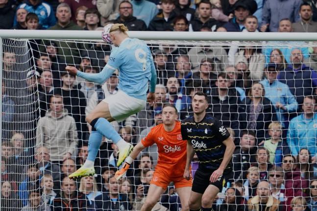 
Manchester City’s Erling Haaland scores his side’s opening goal during the Premier League football match against Everton in Manchester, England yesterday.