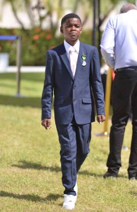 Adrian ‘Ajani’ Ellis after being conferred with the Badge of Honour for Gallantry during the National Honours and Awards Ceremony held on the lawns of King’s House in St Andrew yesterday.