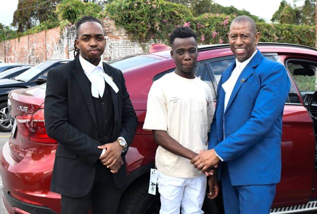 Dantay Brooks (centre) stands with Hugh Wildman (right) and Shemar Bryan, his attorneys, after his release from the Tower Street Adult Correctional Centre, Kingston, on March 7, 2025.