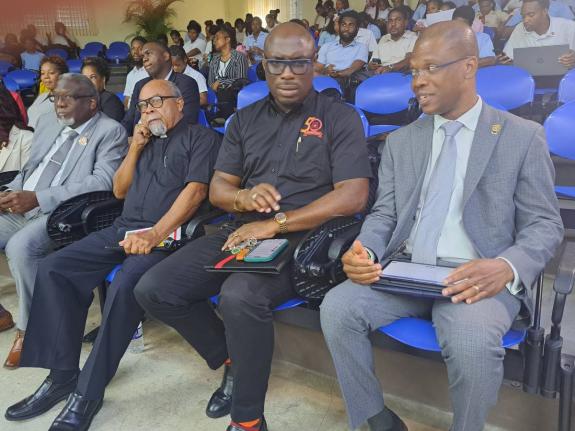 Dr Kevin Brown (right), president of the University of Technology, Jamaica, chats with Dr Darien Henry (second right), principal of the Montego Bay Community College, during the Dr Lorna Nembhard Public Lecture on Wednesday. Also pictured (from left) are B