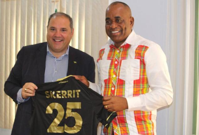 Prime Minister of Dominica, Roosevelt Skerrit (right), presents a jersey to FIFA vice-president and Concacaf president, Victor Montagliani, during his visit to the island yesterday.