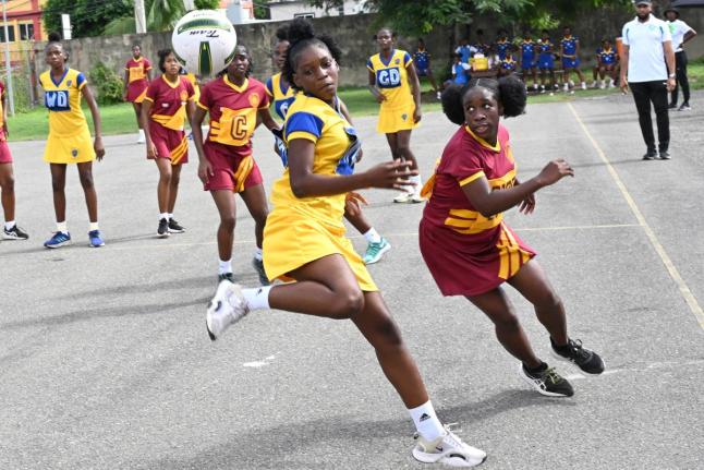 Action in the ISSA Urban Schoolgirl Netball competition between Wolmer’s Girls (in maroon) and Merl Grove at Wolmer’s Girls’ School on Friday, September 27, 2024..