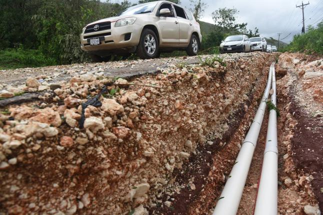 Damage to the Spur Tree main road in Manchester arising from Hurricane Melissa.