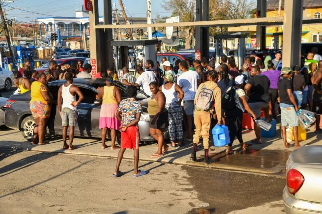 Residents scramble to get gasolene for their vehicles, generators and the like at Total gas station, Savanna-la-Mar, Westmoreland, on October 31. 