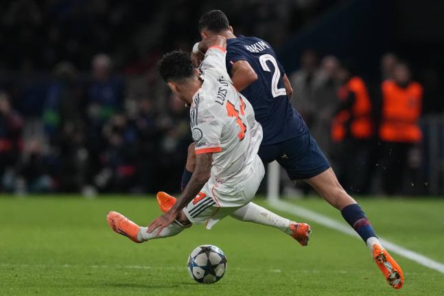 Bayern Munich’s Luis Diaz fouls Paris Saint-Germain’s Achraf Hakimi during the Champions League opening phase match in Paris, France on Tuesday.