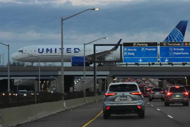 A United Airlines flight arrives at O'Hare International Airport in Chicago, Monday, November 3, 2025. (AP Photo/Nam Y. Huh)