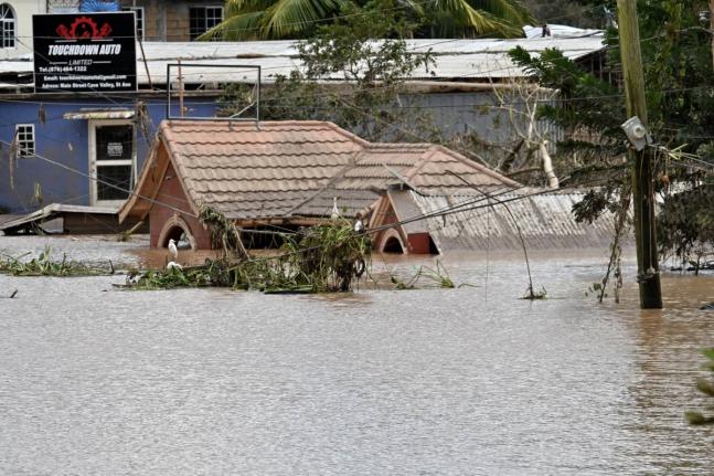 Structures are seen submerged under water in Cave Valley, St Ann, after the passage of Hurricane Melissa.