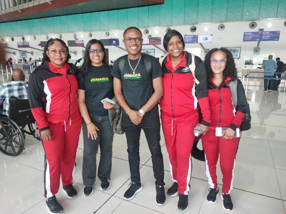 Assistant Commissioner Christopher Phillips (centre), general manager, Police National Netball Team, is joined by (from left) Andrea Roberts, Nichole Lord (team nurse), Keneisha Beckett, and Coletta Leslie ahead of the team’s departure from Jamaica.