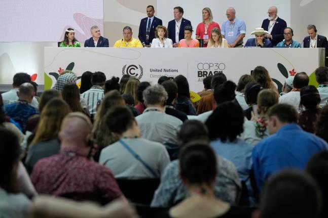 Sophia Hermans, deputy prime minister of the Netherlands, fourth from left sitting, speaks during a session surrounded by other countries at the COP30 UN Climate Summit, Friday, November 21, 2025, in Belem, Brazil. (AP Photo/Fernando Llano)
