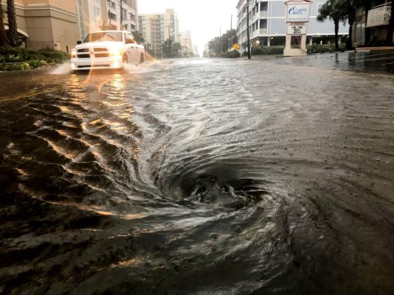 AP 
Floodwaters swirl around after a hurricane which provide a perfect breeding ground for diseases. 