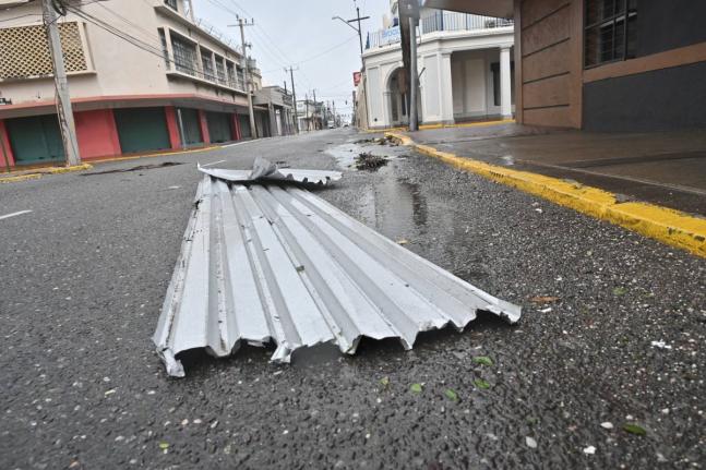 Zinc sheeting is seen in the street after being blown from its moorings by Hurricane Melissa, October 28, 2025.