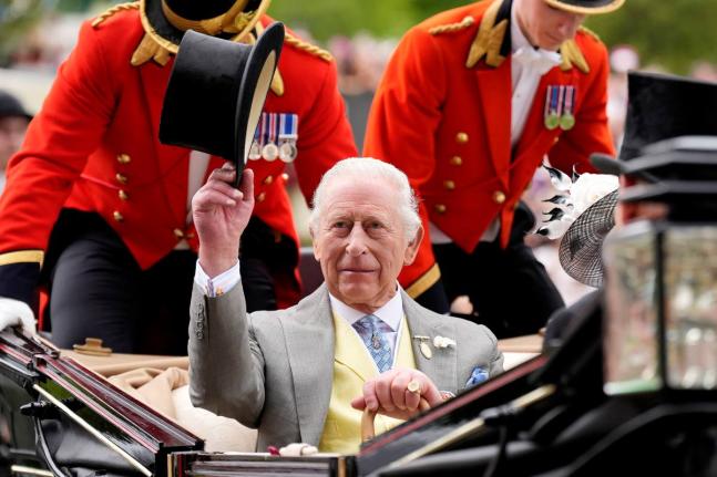 Britain’s King Charles III arrives by royal carriage during day five of Royal Ascot at Ascot Racecourse, England.