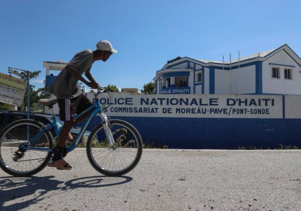  A man rides his bicycle past police station in Pont-Sonde, Haiti, October 7, 2024. (AP Photo/Odelyn Joseph, File)
