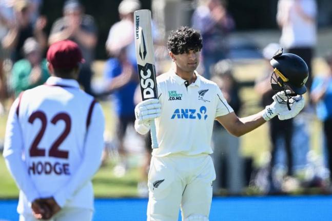 New Zealand’s Rachin Ravindra celebrates after reaching his century against the West Indies on day three of the first Test in Christchurch, New Zealand, on Thursday, December 4, 2025. 