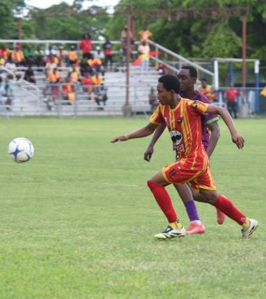 Cornwall College’s Ameche Robinson (left) tries to outrun William Knibb Memorial High’s Shavon Lewis during their round of 16 ISSA daCosta Cup match at Drax Hall Sports Complex  on Saturday, November 29, 2025. Cornwall won 4-0.