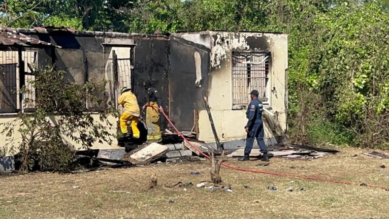Firefighters at a house fire in Lime Tree Grove, St Catherine on December 6, 20205. The body of a man was found inside the dwelling. 