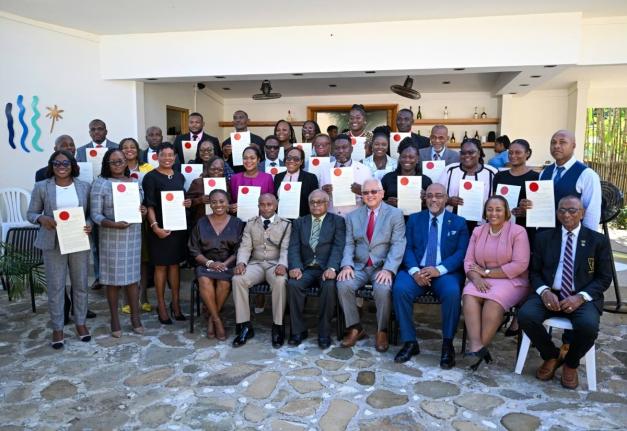 Minister of Justice and Constitutional Affairs, Delroy Chuck (seated centre), and Custos of St Mary, Errol Johnson (seated, third left), with newly minted justices of the peace of St Mary, during the commissioning ceremony held in Port Maria.