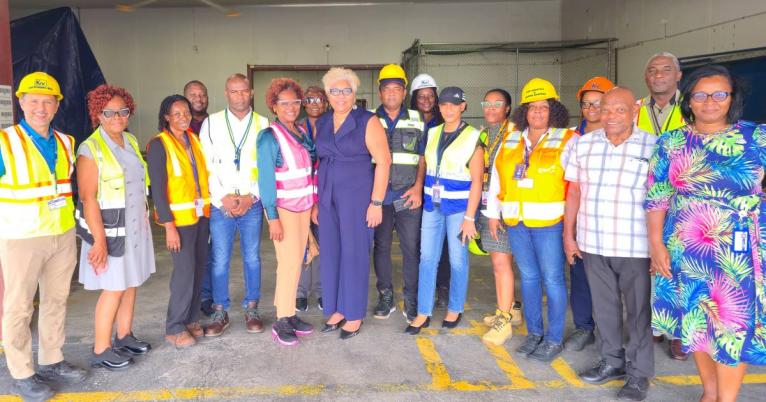 Kingston Wharves officials take commercial partners from the Customs Brokers and Freight Forwarders Association of Jamaica and the Jamaica Society of Customs Brokers on a tour of the company’s new Commercial Stripping Centre.