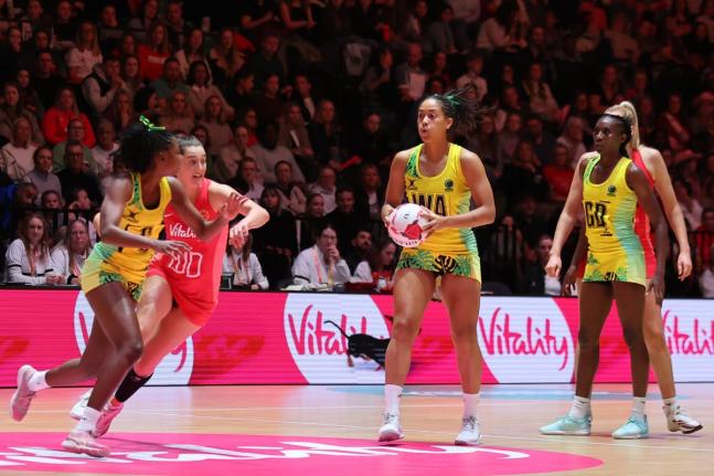 England-born Rhea Dixon (centre) gets ready to make a pass for the Sunshine Girls in the first game of the Horizon Netball Series against England’s Vitality Roses at the 02 Arena in Manchester, England on November 28, 2024.