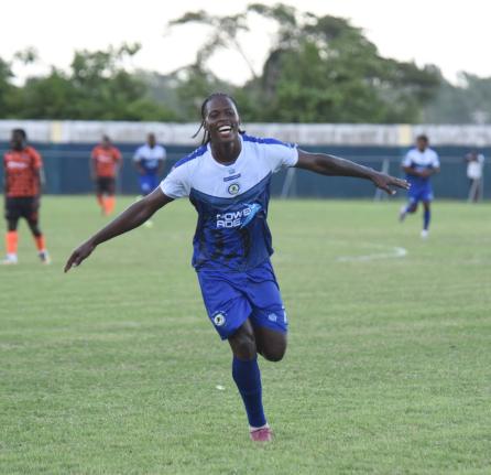 Mount Pleasant Academy's Warner Brown celebrates after scoring against Tivoli Gardens FC during their Jamaica Premier League game at Drax Hall Sports Complex yesterday.