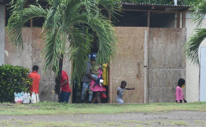 In this 2023 photo Haiti nationals are seen in the compound of the Seventh Day Adventist operated Camp Don in Robins Bay, St. Mary.
