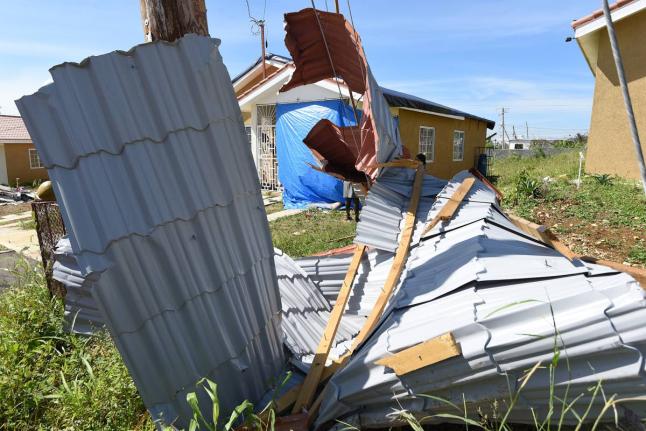 Roofing of houses blown off by Hurricane Melissa are seen in Union Acres, Montego Bay, St James.