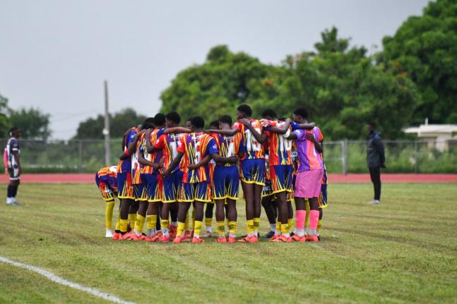 Matthew McKoy/Photographer 
St Andrew Technical High School players get into their customary huddle before an ISSA/WATA Manning Cup match. 
