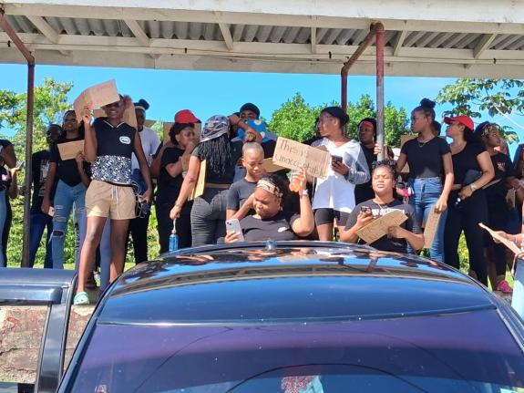 Students of the College of Agriculture, Science and Education demonstrate on December 12, 2025 to protest the alleged rape of a female student on the Portland-based campus, calling for improved security and safety measures.