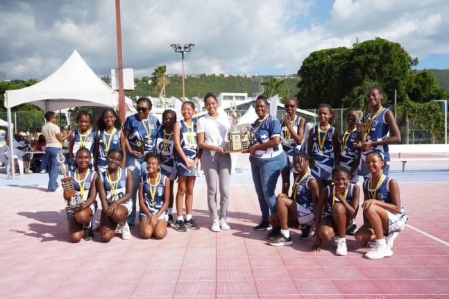 Mona Preparatory School’s under-12 netball team celebrates after securing a third straight JISA championship, following a dominant 14–4 victory over Emmanuel Christian Academy at the Leila Robinson Court, National Stadium, on Thursday.