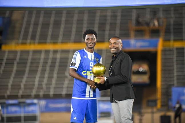 Mount Pleasant Football Academy club captain, Daniel Green, is awarded the Golden Ball after the Concacaf Caribbean Cup final against Universidad O&M at the National Stadium on December 2.