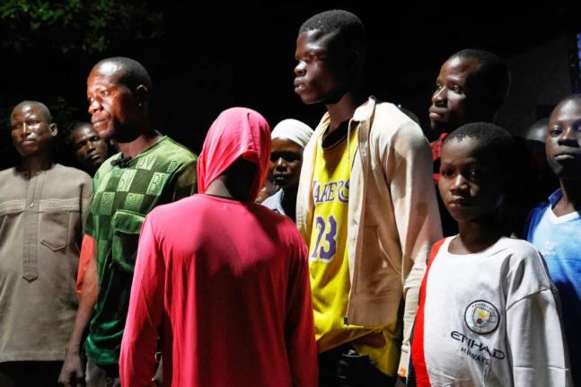 Freed students of St. Mary’s Catholic School are reunited with their parents in Papiri community, Nigeria, Tuesday, December 9, 2025.