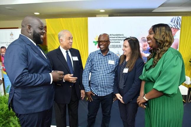 Parris Lyew-Ayee (second left), chairman, JN Foundation exchanges pleasantries with Dr. Tiou Clarke (left), lecturer at the University of Technology, Jamaica; Dr Ricardo Anderson (centre), lecturer in the Department of Computing, The University of the West