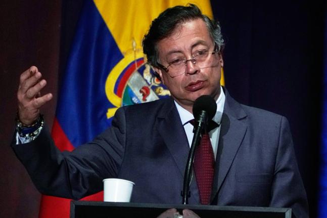Colombia's President Gustavo Petro speaks at a ceremony marking the ninth anniversary of the signing of a peace deal between the state and the Revolutionary Armed Forces of Colombia (FARC), in Bogota, Colombia, Wednesday, November 26, 2025. (AP Photo/Ferna