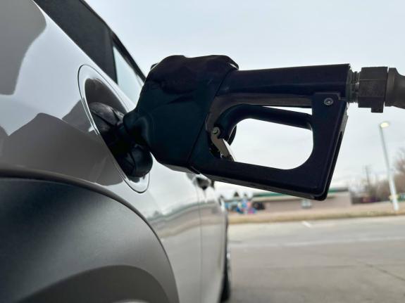 AP
A motorist fills up the tank of a vehicle at a gasolene station Sunday on November 30. 