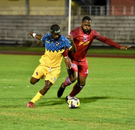 Racing United’s Nickyle Ellis (left) and Montego Bay United’s Josiah Trimmingham battle for the ball during their Jamaica Premier League match at the Montego Bay Sports Complex on Sunday, October 19, 2025.