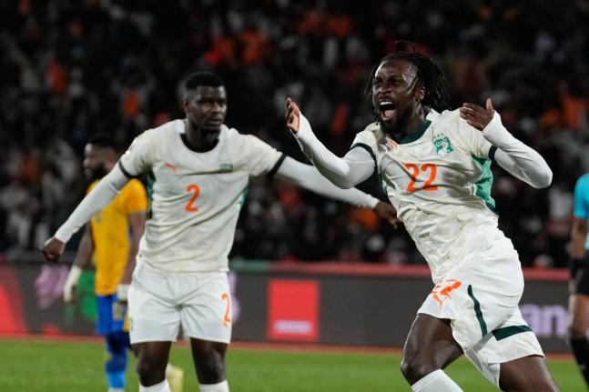 Ivory Coast’s Evann Guessand (right) celebrates after scoring during the Africa Cup of Nations Group F football match against Gabon in Marrakech, Morocco yesterday. Looking on is Ivory Coast’s Ousmane Diomande.