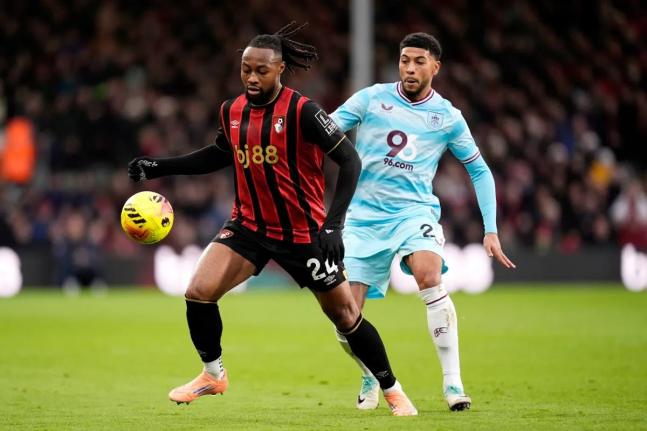 Bournemouth’s Antoine Semenyo (left) and Burnley’s Josh Laurent vie for the ball during the English Premier League  match between Bournemouth and Burnley at the Vitality Stadium, in Bournemouth, England, Saturday, December 20, 2025. 