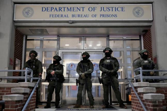 Federal law enforcement personnel stand watch outside the Metropolitan Detention Center as they await the arrival of captured Venezuelan President Nicolás Maduro in New York. 