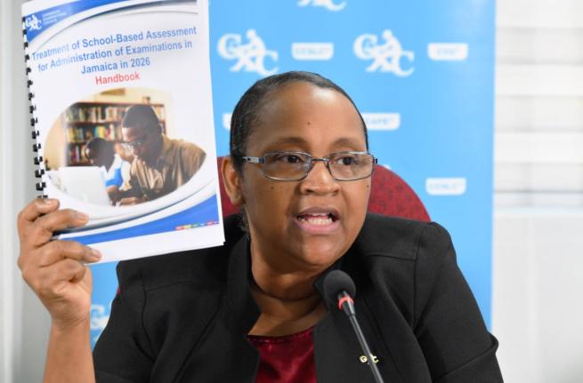 Caribbean Examinations Council (CXC) Director of Operations, Dr Nicole Manning, displays a copy of the School-Based Assessment (SBA) Concession document during a CXC press conference held at the Overseas Examinations Commission (OEC) in St Andrew on Januar