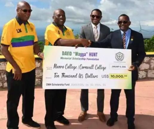 
From left: David ‘Wagga’ Hunt Foundation committee members, Leighton ‘Fyah’ McKnight and Garth Pottinger, present a cheque for US$10,000 to principals, Dr Mark Smith and Michael Ellis of Munro College and Cornwall College, respectively. 