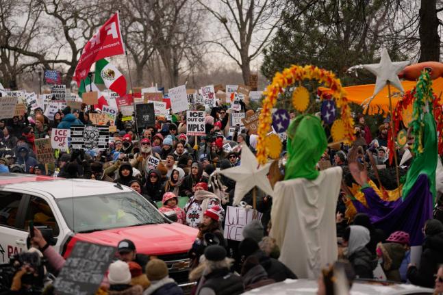 Protesters gather during a rally for Renee Good, who was fatally shot by an ICE officer in Minneapolis. 