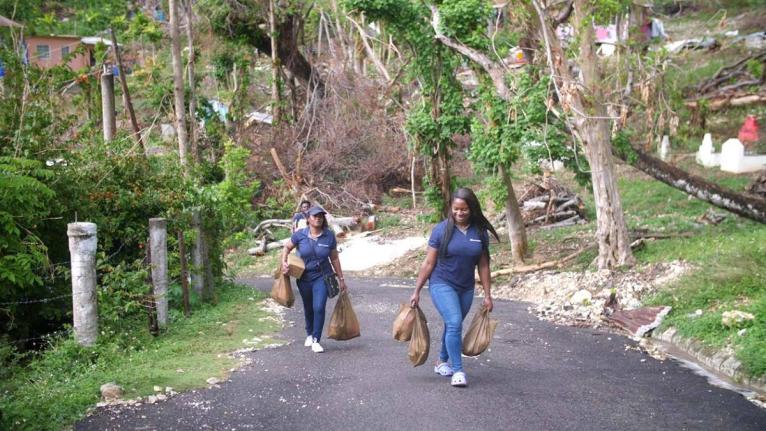 Intcomex Jamaica brought early Christmas cheer to over 100 families in Cave District, Westmoreland, on December 13, as part of its six-month adoption of the community to assist with post-Hurricane Melissa recovery.  