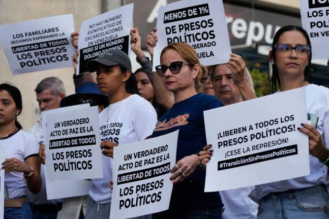 Relatives and friends of political prisoners hold banners calling for their loved ones to be set free outside El Helicoide, the headquarters of Venezuela’s intelligence service and detention centre, in Caracas.