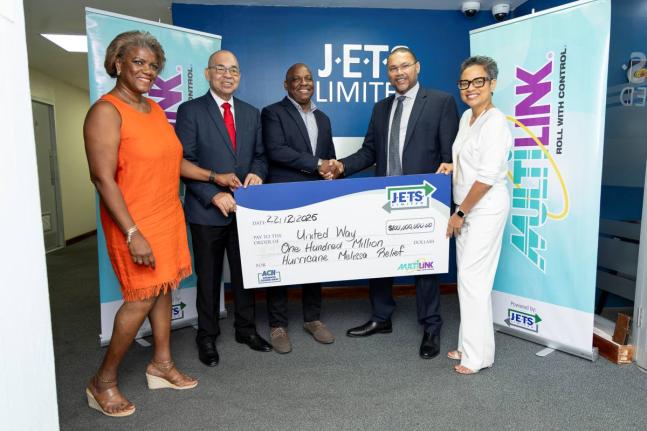 Chair of the Board of Directors for United Way of Jamaica Dr Devon Smith (centre) accepts the cheque for $100 million from J.E.T.S Limited CEO Edmundo Jenez (second right). Also at the handover are: (from left) Strategic Marketing Consultant to JETS Ltd, M